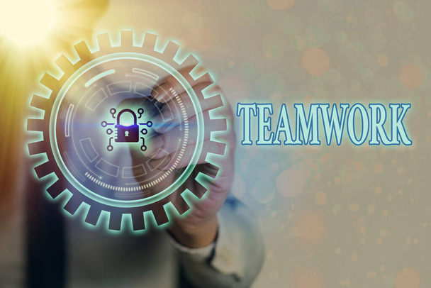 Writing note showing Teamwork. Business photo showcasing the group s is collaborative effort to accomplish a common goal Graphics padlock for web data information security application system. - Photo, Image