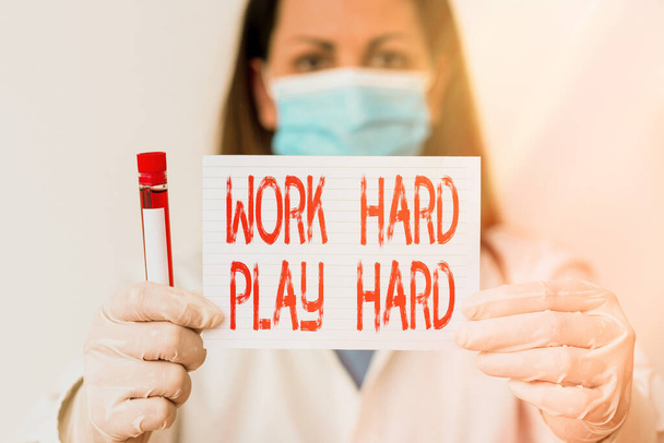 Conceptual hand writing showing Work Hard Play Hard. Business photo showcasing diligent in any activity Party at weekends Hardworking Laboratory blood test sample for medical diagnostic analysis. - Photo, Image