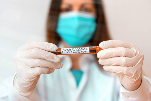 Writing note showing Compliance. Business photo showcasing the action or fact of complying with a wish or commands Laboratory blood test sample for medical diagnostic analysis. - Φωτογραφία, εικόνα