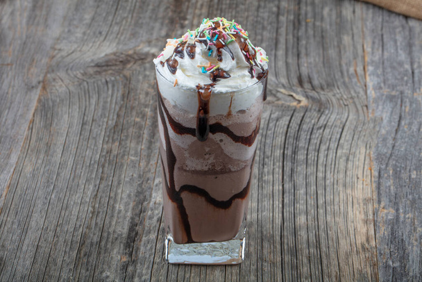 Delicious milkshakes on wooden background. chocolate milkshake. - Foto, imagen