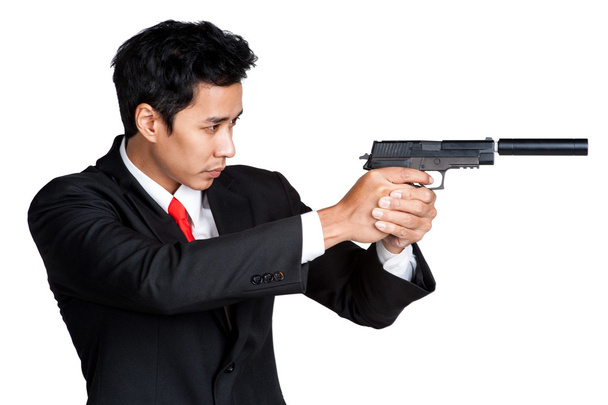business man holding gun shoot - Foto, afbeelding
