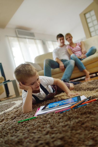 Family at home using tablet computer - Zdjęcie, obraz