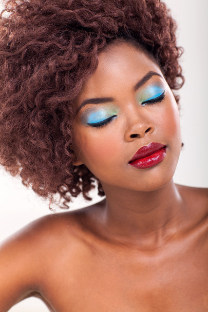 African woman's face with colorful makeup - Fotoğraf, Görsel