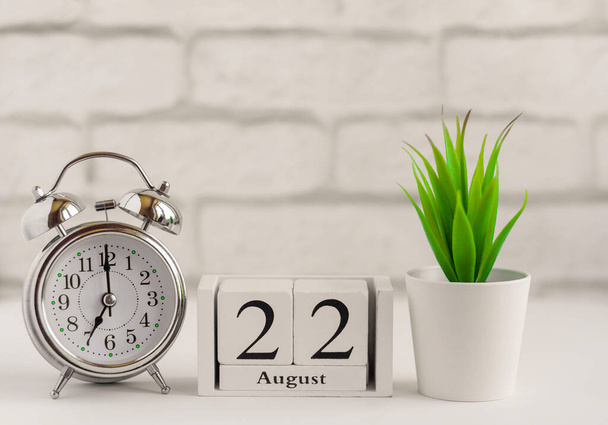 June 12nd. Day 12 Of Month, Calendar Date. White Alarm Clock On Red  Background With Calendar Date. Concept Of Time, Deadline, Time To Work,  Morning. Summer Month, Day Of The Year Concept