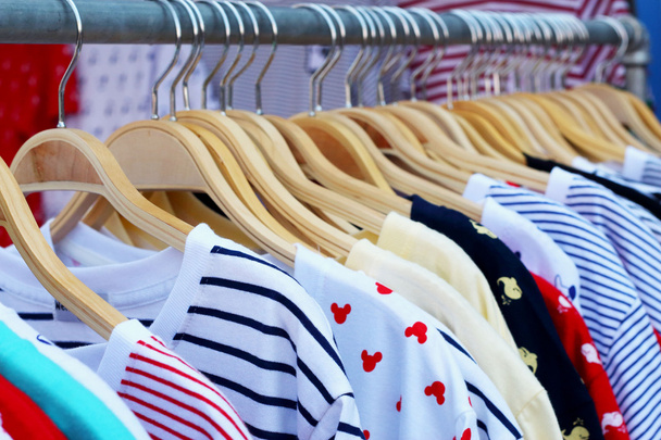 Shop shirts hanging on a rack market - Photo, Image