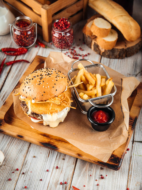 Burger with beef patty and three types of cheese - Photo, Image