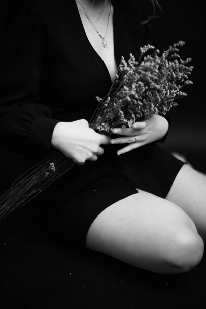 Black and white art fashion surrealistic portrait of beautiful woman,details of body black and white portrait of beautiful girl,fashion and art,portrait with plants and flowers - Fotó, kép