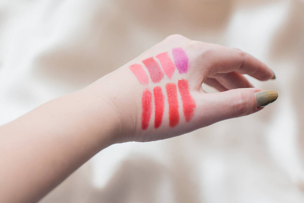Matte lipstick for lips in different colors. Decorative cosmetics and summer - spring colors in makeup - 写真・画像
