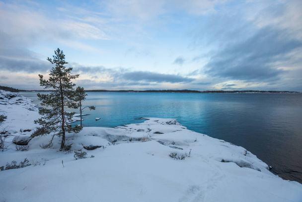 Rocky shore of Lake Ladoga. Leningrad region winter landscape, Russia - Valokuva, kuva