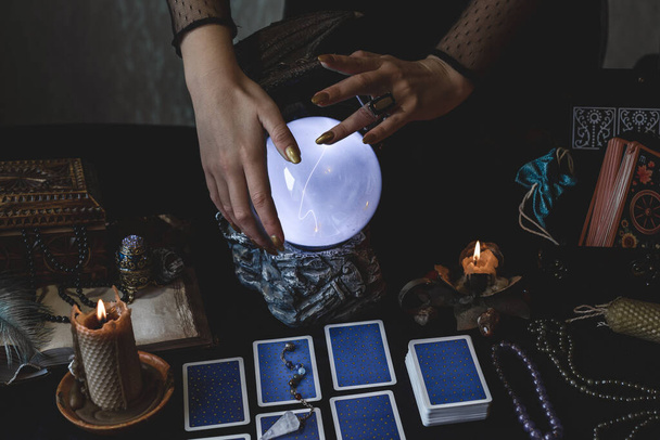 Europe, Ukraine. Kiev June 27 : Illustrative Editorial. Mystical atmosphere, view of tarot card on the table, esoteric concept, fortune telling and predictions - Фото, изображение