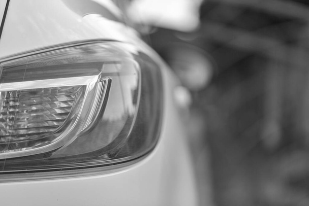 Car's exterior details.Element of design.Rear light. Rear light of a modern white car. - Photo, Image