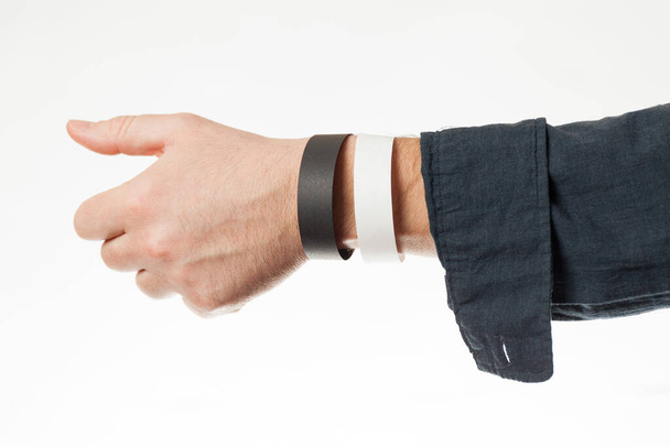 Black and white version of blank bracelet on hand. Paper festival branding wristband, mockup. - Fotó, kép