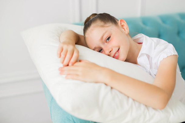 beautiful young girl teenager lies on a pillow - Foto, Imagem