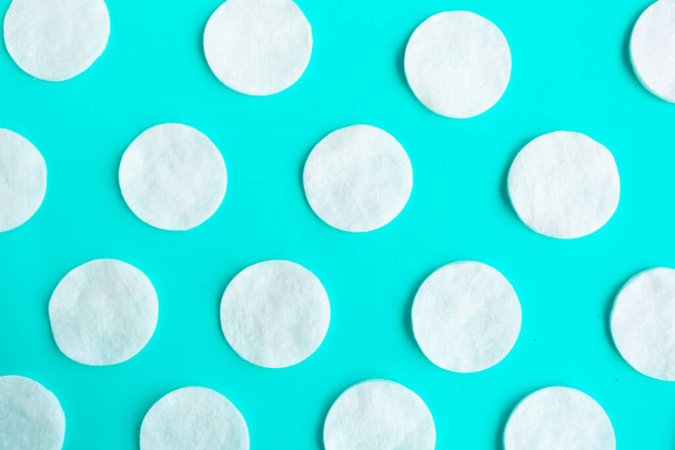 Cotton sponges pattern on blue background, minimal concept - Фото, изображение