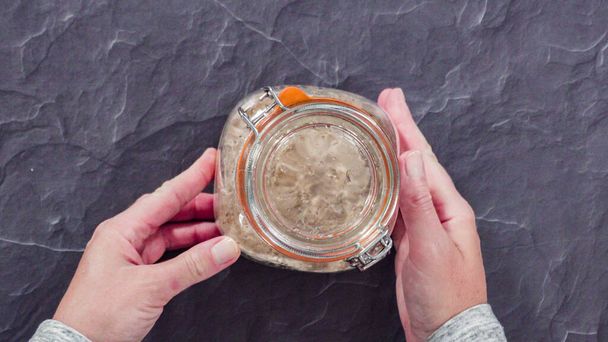 Wheat sourdough starter in a glass mason jar. - Photo, Image