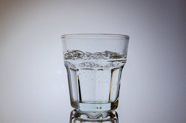 Still water with bubbles in a glass (old fashioned/ rocks) - Photo, Image