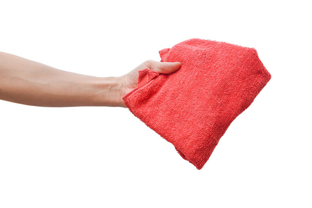 Male hand holding red cloth isolated on white background with clipping path. - Photo, Image