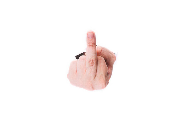 Middle Finger Man through a hole in paper on a white background isolate. close up, copy space. - Photo, Image