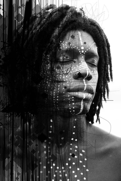 Portrait of young african man with closed eyes and traditional face paint shot at a three quarters angle - Fotoğraf, Görsel