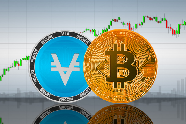 Bitcoin (BTC) e Viacoin (VIA) monete sullo sfondo del grafico; bitcoin e viacoin criptovaluta; scambio crypto - Foto, immagini