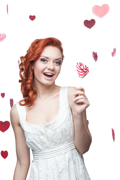 Happy red woman holding lollipop - Photo, image