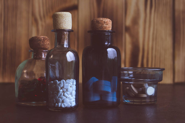 White drugs in glass bottles with a cork. - Fotó, kép