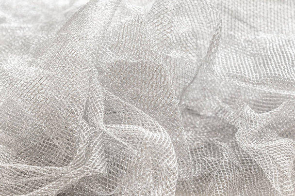 abstract background of silver mesh fabric close up - Valokuva, kuva
