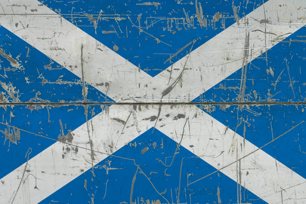 Scotland flag painted on cracked dirty surface. National pattern on vintage style surface. Scratched and weathered concept. - Foto, Imagen