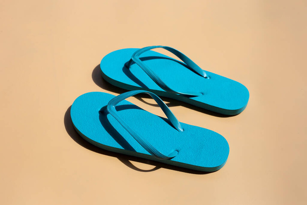 Blue flip flops on brown background.  - Photo, Image