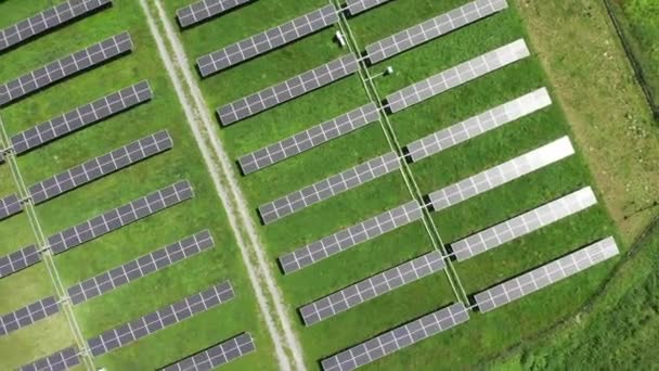 Aerial view of solar power station. Aerial top view of solar farm. Concept of clean energy, green energy, renewable energy. Alternative energy concept. Photovoltaic panels.  - Footage, Video