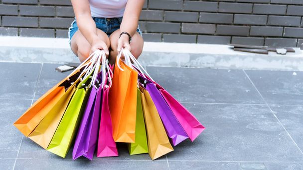 Shopping bags of women crazy shopaholic person at fashion shopping mall indoor. Fashionable Woman love online shopping website with sales tag. E-commerce digital marketing happy city lifestyle person - Photo, Image