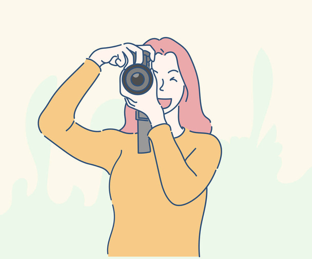 Jeune femme prenant une photo avec un appareil photo. Dessiné à la main dans un style ligne mince, illustrations vectorielles. - Vecteur, image