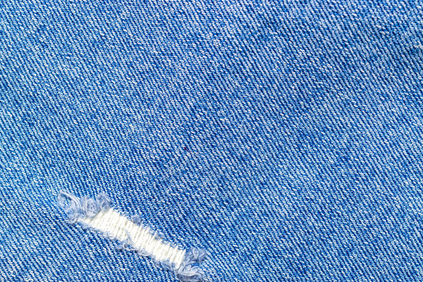 Denim texture. Blue jeans textile pattern with copy space for material fashion background. Indigo fabric cloth in close up - Photo, Image
