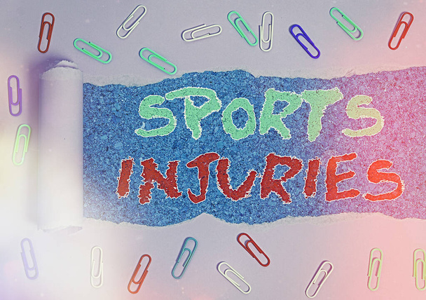 Word writing text Sports Injuries. Business concept for injuries that occur when engaging in sports or exercise Rolled ripped torn cardboard placed above a wooden classic table backdrop. - Photo, Image
