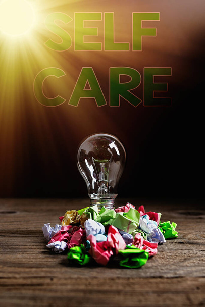 Text sign showing Self Care. Conceptual photo the practice of taking action to preserve or improve one s is health Realistic colored vintage light bulbs, idea sign solution thinking concept. - Photo, Image