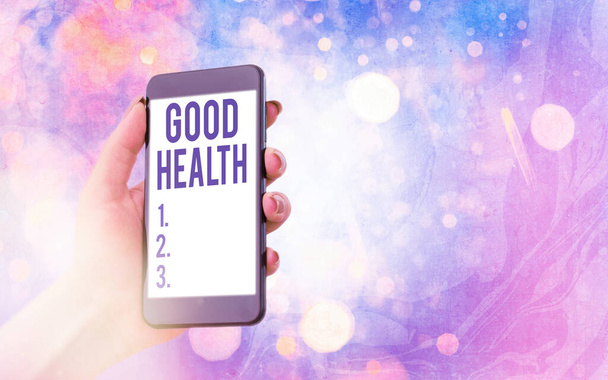 Text sign showing Good Health. Conceptual photo state of being vigorous and free from a bodily or mental disease Modern gadgets with white display screen under colorful bokeh background. - Photo, Image