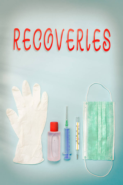 Writing note showing Recoveries. Business photo showcasing process of regaining possession or control of something lost Primary medical precautionary equipments for health care protection. - Photo, Image
