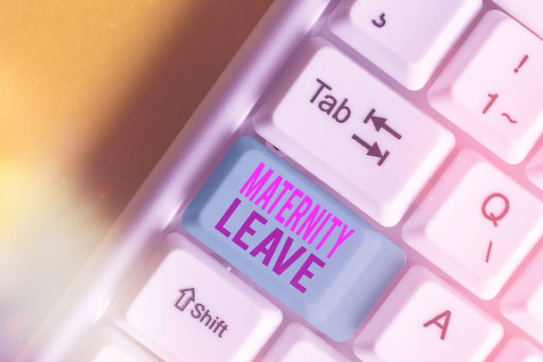 Text sign showing Maternity Leave. Conceptual photo a leave of absence for an expectant or a new mother White pc keyboard with empty note paper above white key copy space. - Photo, Image