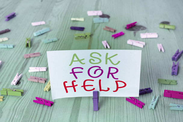 Conceptual hand writing showing Ask For Help. Business photo showcasing put a question or seek an answer or assistance from someone Colored crumpled rectangle shape paper light blue background. - Photo, Image