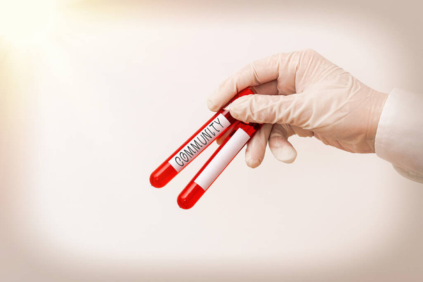 Word writing text Community. Business concept for group of showing with a common characteristics living together Extracted blood sample vial ready for medical diagnostic examination. - Photo, Image