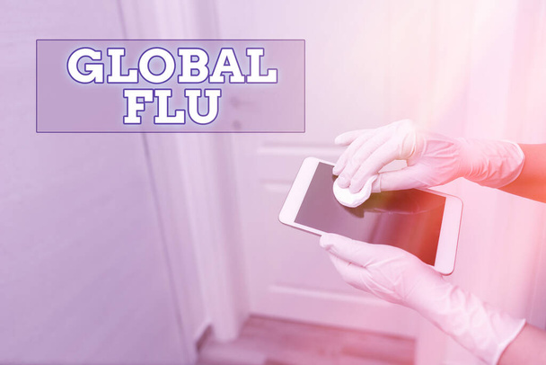 Текст написання слів Global Flu. Бізнес-концепція поширення спільних хвороб по всьому світу швидко Забруднення в електронних гаджетах, керованих дезінфікуючим засобом
. - Фото, зображення