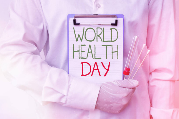Записка, що показує Всесвітній день здоров'я. Business photo демонструє глобальний день обізнаності про здоров'я, що відзначається щороку 7 квітня на аналізі крові лабораторних аналізів для діагностичного аналізу. - Фото, зображення