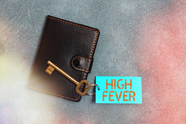 Handwriting text writing High Fever. Concept meaning medical condition which the body temperature higher than usual Paper accesories with digital smartphone arranged on different background. - Photo, Image