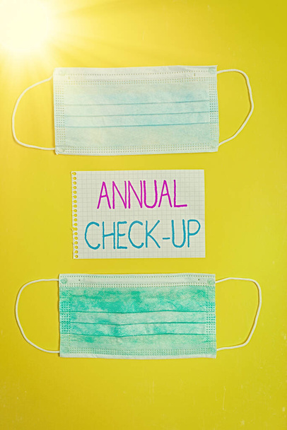 Conceptual hand writing showing Annual Checkup. Business photo text yearly reproductive health visit with a health care provider Set of medical equipment with notepad for health assessment. - Photo, Image