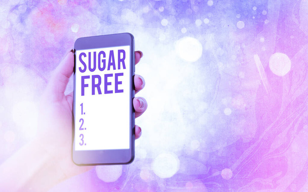Text sign showing Sugar Free. Conceptual photo do not contain sugar and only have artificial sweetener instead Modern gadgets with white display screen under colorful bokeh background. - Photo, Image