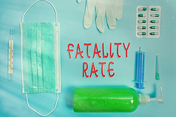 Word writing text Fatality Rate. Business concept for calculated number of deaths over a specific range of period Primary medical precautionary equipments for health care protection. - Фото, изображение