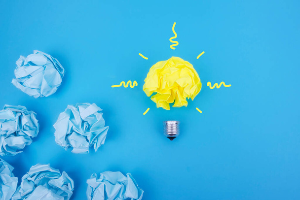 Idea concept with colorful crumpled paper in the form of a light bulb, be different. - Fotografie, Obrázek