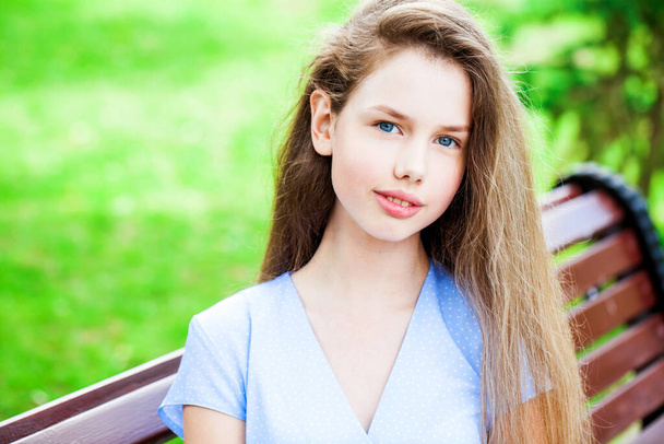 Portrait of a young beautiful girl in a summer dress  - Fotografie, Obrázek