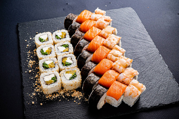 sushi set on the black background - Photo, image