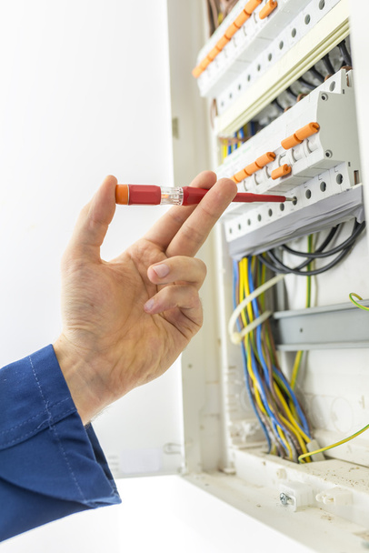 Electrician checking the electrical supply box - Photo, Image
